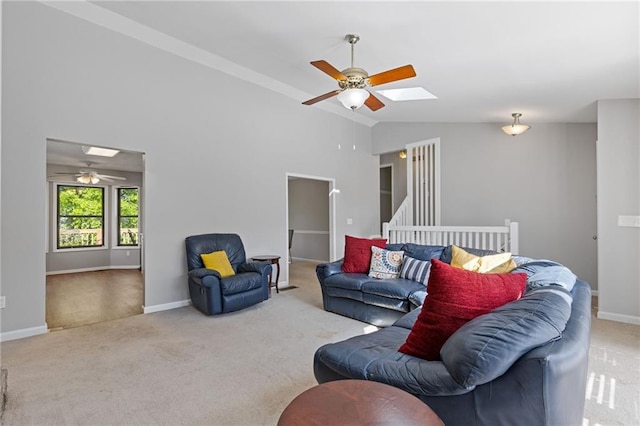 4811 Nevilly Way, Marietta, GA 30066 - carpeted living area featuring lofted ceiling with skylight, a ceiling fan, and baseboards