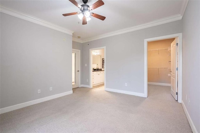 2304 Village Blvd, Rome, GA 30161 - unfurnished bedroom with crown molding, a walk in closet, light colored carpet, baseboards, and a closet