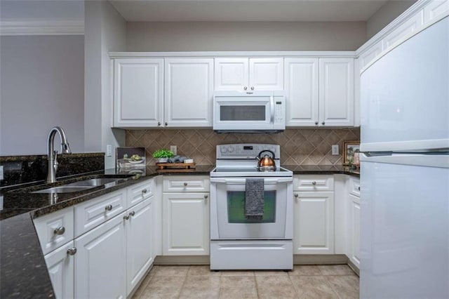 2304 Village Blvd, Rome, GA 30161 - kitchen with white appliances, a sink, white cabinets, decorative backsplash, and dark stone countertops