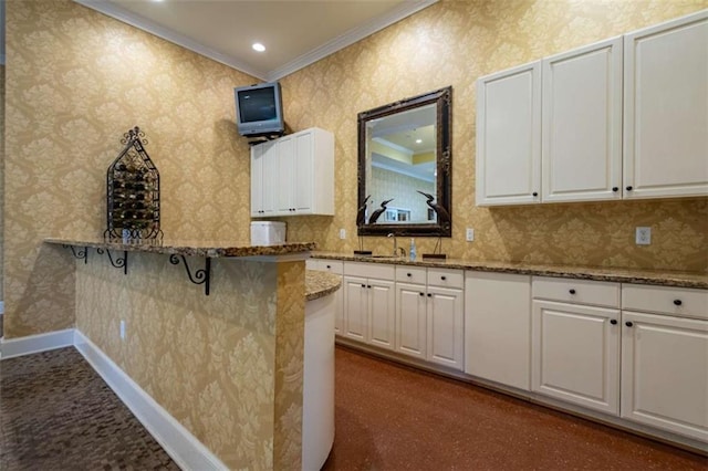 2304 Village Blvd, Rome, GA 30161 - kitchen featuring ornamental molding, white cabinetry, stone countertops, a breakfast bar, and a sink