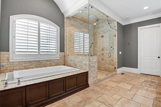 bathroom with tile patterned floors, shower with separate bathtub, and ornamental molding