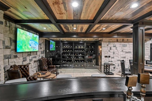 bar with tile patterned floors, wooden ceiling, and tile counters