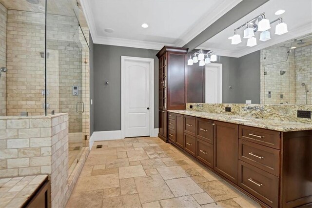 bathroom with tile patterned flooring, an enclosed shower, crown molding, and double sink vanity