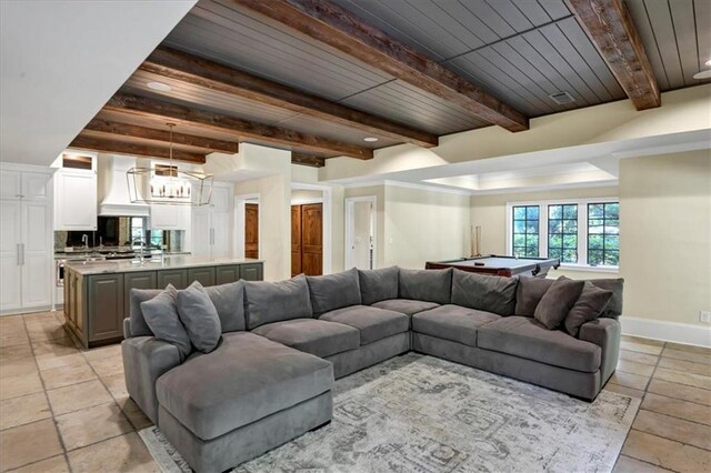 living room with beamed ceiling, pool table, wooden ceiling, and light tile patterned floors