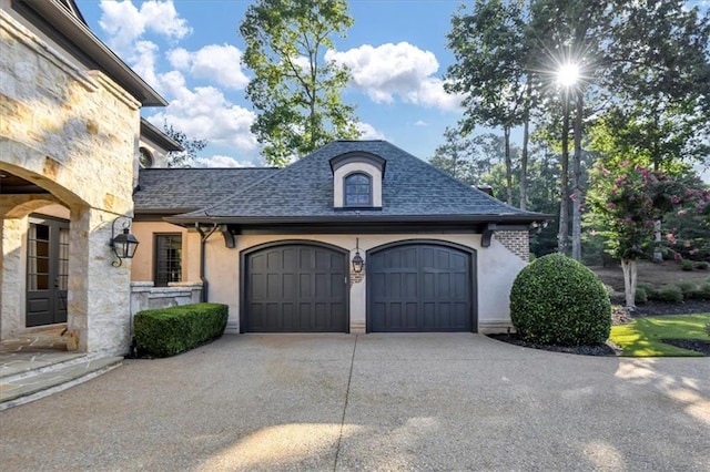 view of side of home featuring a garage