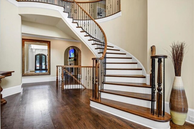 stairs featuring wood-type flooring