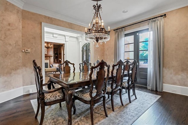 dining room featuring crown molding, a chandelier, and dark hardwood / wood-style floors