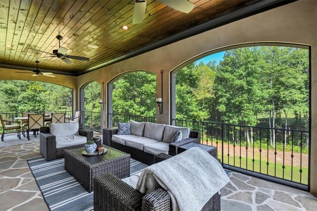 view of patio featuring an outdoor living space and ceiling fan