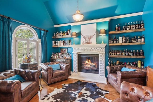 3215 Kylee Dawn Cir, Lawrenceville, GA 30045 - living area with a glass covered fireplace, wood finished floors, and high vaulted ceiling