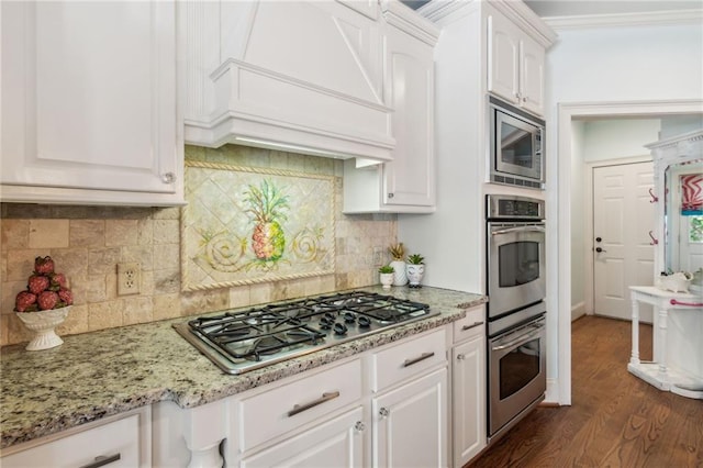 3215 Kylee Dawn Cir, Lawrenceville, GA 30045 - kitchen with light stone countertops, white cabinets, stainless steel appliances, and dark wood-type flooring
