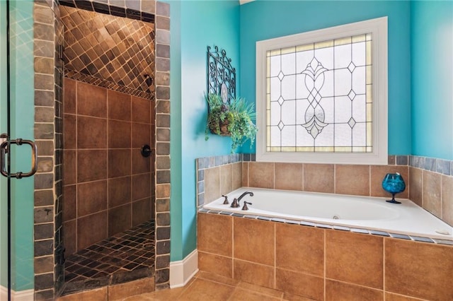 3215 Kylee Dawn Cir, Lawrenceville, GA 30045 - bathroom with a tile shower, tile patterned flooring, and a bath