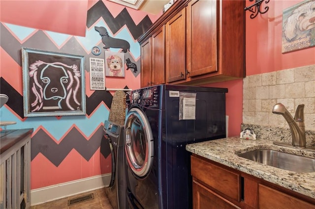 3215 Kylee Dawn Cir, Lawrenceville, GA 30045 - washroom with visible vents, baseboards, cabinet space, and a sink