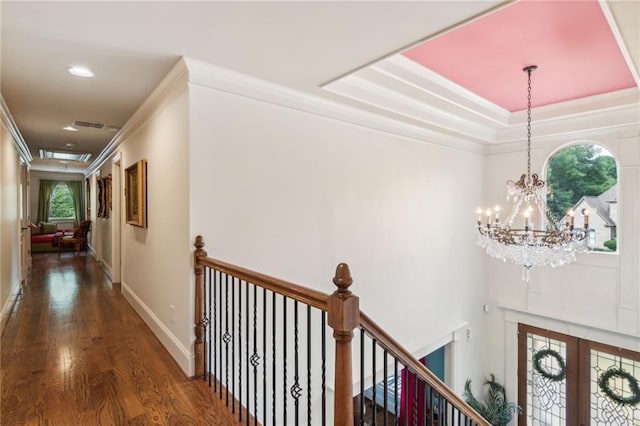 3215 Kylee Dawn Cir, Lawrenceville, GA 30045 - hallway with crown molding, an upstairs landing, a chandelier, and wood finished floors