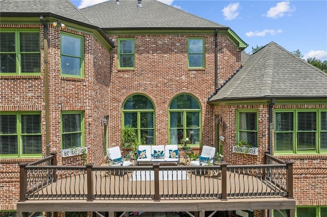 3215 Kylee Dawn Cir, Lawrenceville, GA 30045 - rear view of house featuring roof with shingles, outdoor lounge area, and brick siding
