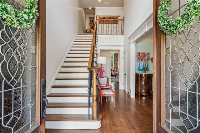 3215 Kylee Dawn Cir, Lawrenceville, GA 30045 - foyer entrance with baseboards, wood finished floors, stairs, and a towering ceiling