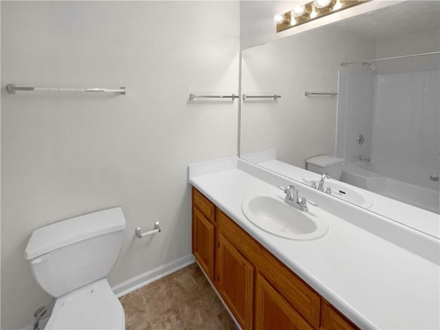 full bathroom with toilet, vanity, washtub / shower combination, and baseboards