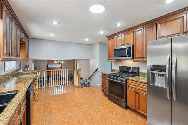 2201 Colonial Oak Way, Stone Mountain, GA 30087 - kitchen with appliances with stainless steel finishes, recessed lighting, light stone countertops, brown cabinets, and a sink