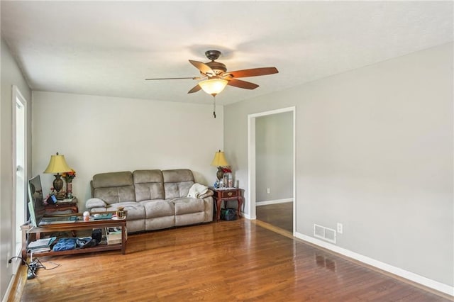 2201 Colonial Oak Way, Stone Mountain, GA 30087 - living area featuring a ceiling fan, wood finished floors, and baseboards