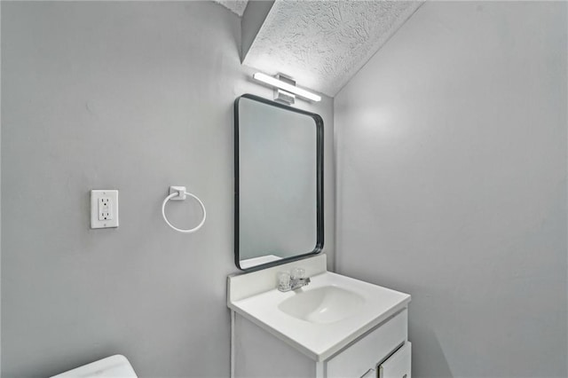 2201 Colonial Oak Way, Stone Mountain, GA 30087 - bathroom featuring vanity, toilet, and a textured ceiling