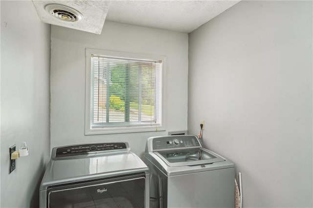 2201 Colonial Oak Way, Stone Mountain, GA 30087 - laundry area featuring independent washer and dryer and a textured ceiling