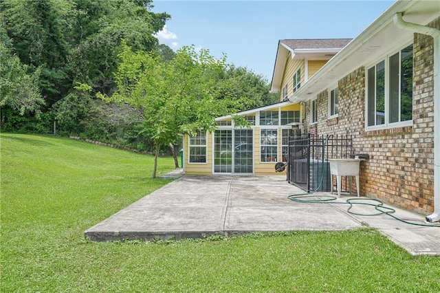 2201 Colonial Oak Way, Stone Mountain, GA 30087 - view of green lawn with a patio area and a sunroom