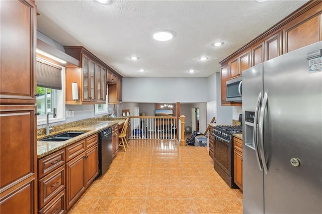 2201 Colonial Oak Way, Stone Mountain, GA 30087 - kitchen featuring black appliances, a sink, light stone countertops, recessed lighting, and glass insert cabinets