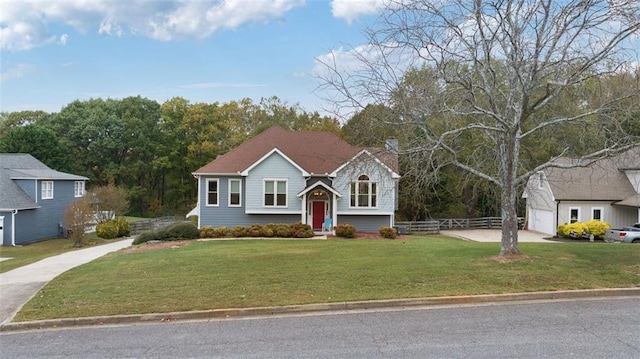 view of front of home with a garage and a front lawn