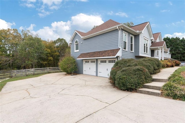 view of side of property featuring a garage