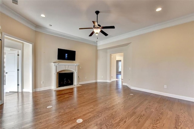 unfurnished living room with crown molding, hardwood / wood-style floors, and ceiling fan