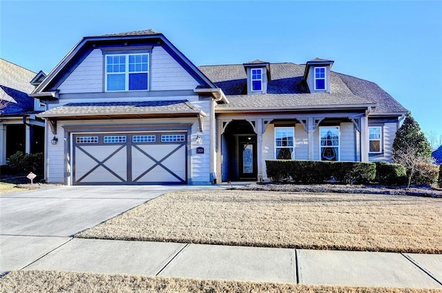 view of front facade with a garage and concrete driveway