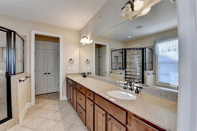 bathroom with vanity, tile patterned floors, and an enclosed shower