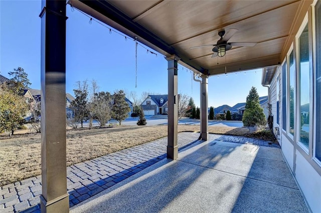 view of patio with a mountain view and ceiling fan