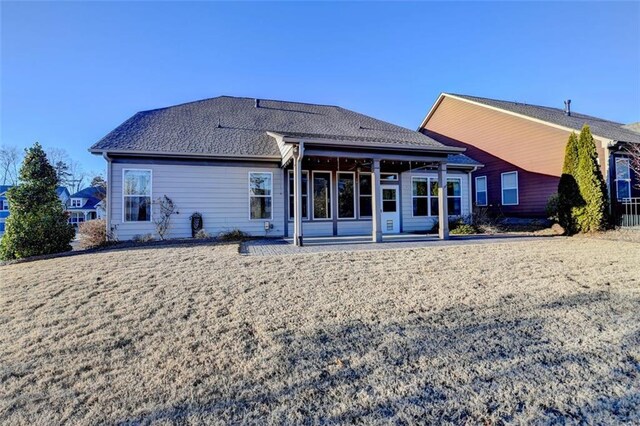 rear view of house featuring a patio