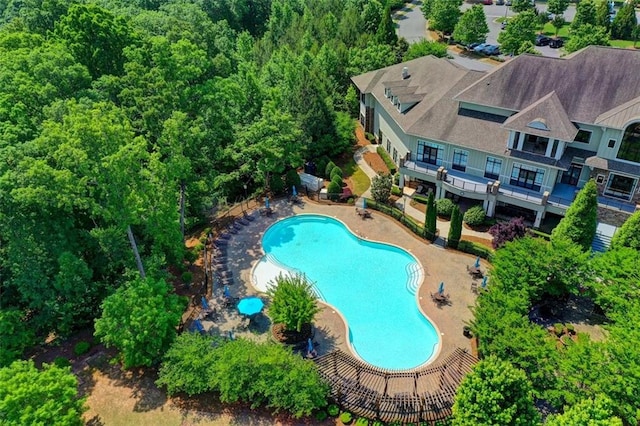 community pool with a patio area