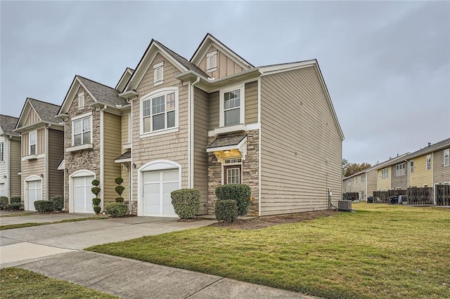 1963 Lakeshore Overlook Cir NW, Kennesaw, GA 30152 - view of property with an attached garage, a front lawn, driveway, and stone siding