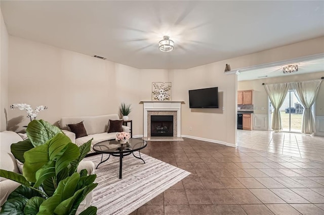 1963 Lakeshore Overlook Cir NW, Kennesaw, GA 30152 - living area featuring tile patterned floors, visible vents, baseboards, and a fireplace