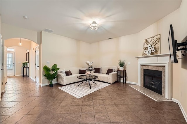 1963 Lakeshore Overlook Cir NW, Kennesaw, GA 30152 - tiled living area with a premium fireplace, arched walkways, baseboards, and visible vents