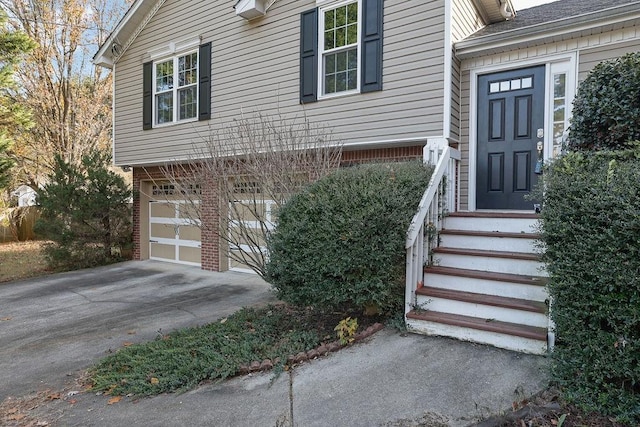 doorway to property featuring a garage