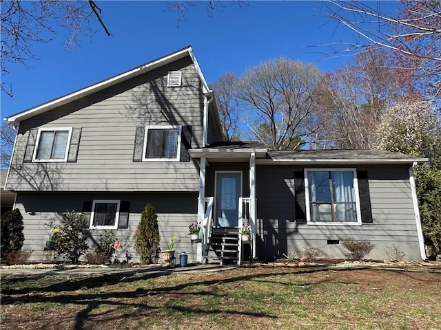 tri-level home with a front yard and crawl space