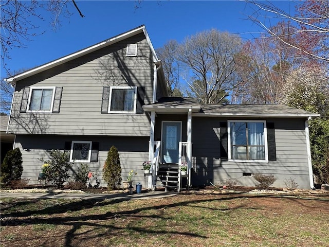 split level home featuring crawl space and a front lawn