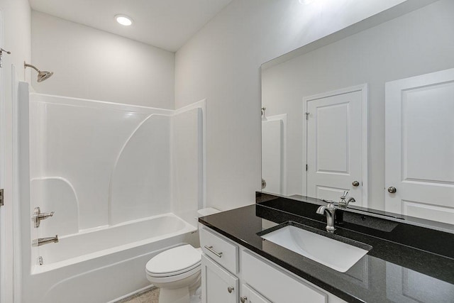 full bathroom featuring toilet,  shower combination, and vanity