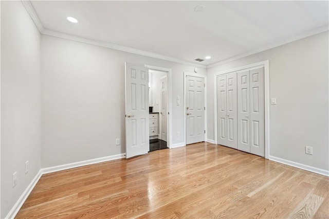 53 Paces W Dr NW, Atlanta, GA 30327 - unfurnished bedroom with visible vents, baseboards, crown molding, light wood finished floors, and recessed lighting