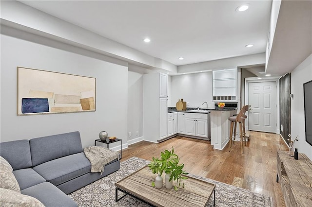 53 Paces W Dr NW, Atlanta, GA 30327 - living room featuring baseboards, recessed lighting, and light wood finished floors