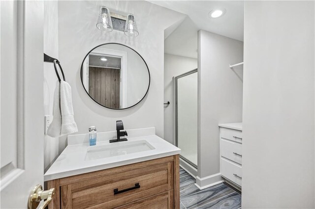 53 Paces W Dr NW, Atlanta, GA 30327 - full bath with recessed lighting, a stall shower, wood finished floors, and vanity