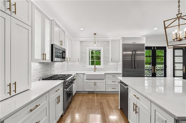 53 Paces W Dr NW, Atlanta, GA 30327 - kitchen featuring high quality appliances, decorative backsplash, a sink, and recessed lighting