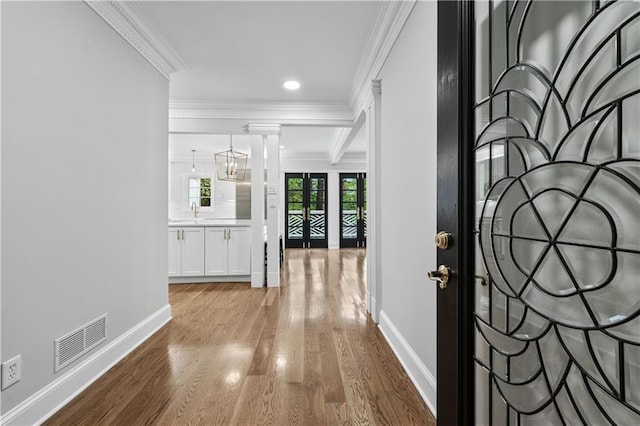 53 Paces W Dr NW, Atlanta, GA 30327 - entrance foyer with visible vents, baseboards, ornamental molding, and wood finished floors