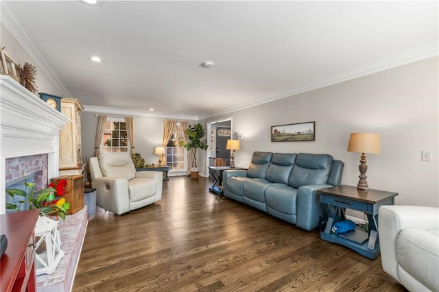 living room featuring crown molding, a brick fireplace, and dark wood-type flooring