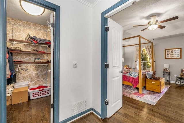 bedroom featuring dark wood-type flooring and ornamental molding