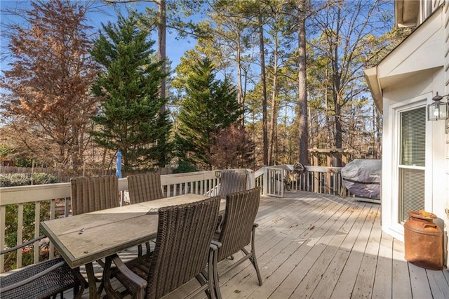 wooden deck featuring area for grilling