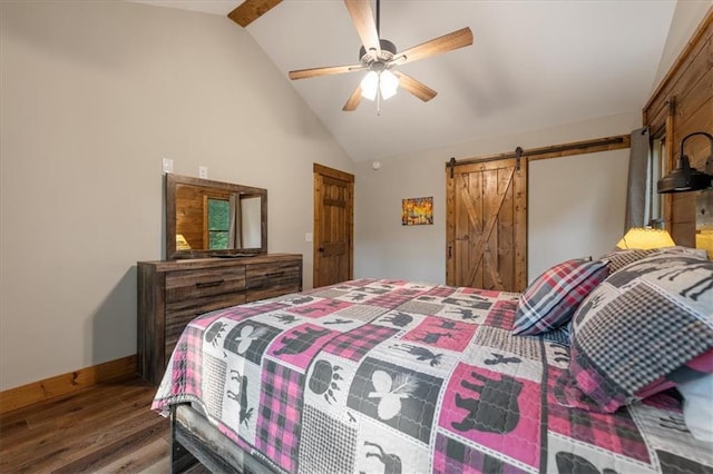 bedroom with lofted ceiling, hardwood / wood-style flooring, ceiling fan, and a barn door